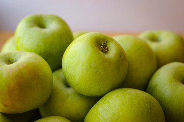 Apples stand on a wooden surface