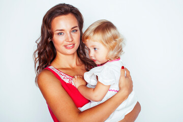 young pretty stylish mother with little cute blond daughter hugging, happy smiling real family, lifestyle people concept