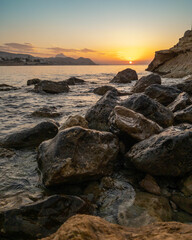 Fototapeta na wymiar sunset at the spanish beach with mountains views