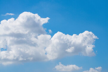 Naklejka na ściany i meble Blue sky background with tiny clouds background.