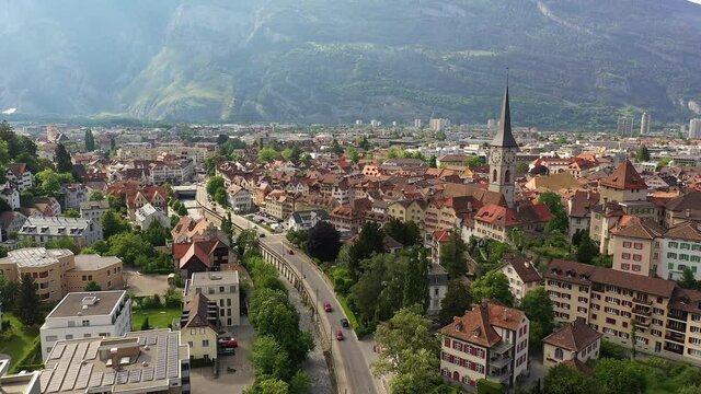 Aerial drone footage of the Chur old town, the capital city of Canton Graubunden in eastern Switzerland in summer. Shot with a forward motion. 