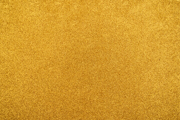 Gold sparkling Lights Festive background with texture. Abstract christmas twinkled bright bokeh defocused