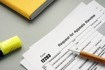  Financial concept about Form 12203 Request for Appeals Review with phrase on the sheet.