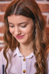 Portrait of a young beautiful girl in a cafe close-up.