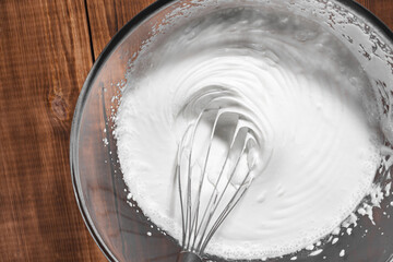 Whisking of cream ingredients for cake. Selective focus. Bakery concept background.