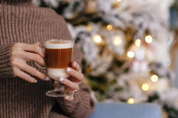 girl holding coffee in her hands