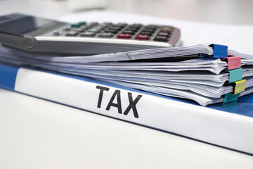 Folder Tax documents and paper files concept Annual tax payment