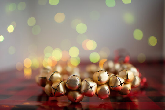 Gold Christmas Bells On Black And Red Wrapping Paper With Fairy Lights