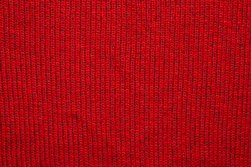 Red knitted wool texture background