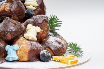 New Year cake croquembouche on white background