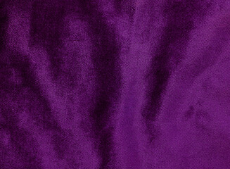 Fototapeta na wymiar violet velvet fabric for background. abstract wavy shiny fabric for luxury concept background. 