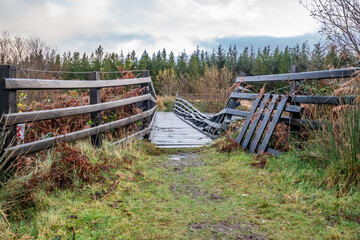 An old, rotten wooden bridge over the Owenea river by Ardara in County Donegal - Ireland