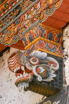 Colorful traditional dragon head carved in wood and painted in Punakha dzong, Bhutan