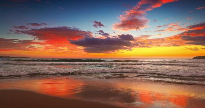 Sea sunrise with colorful cloudscape on sandy beach
