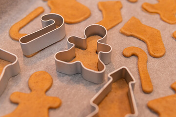 A process of cooking Christmas gingerbread biscuits of a different shape in oven