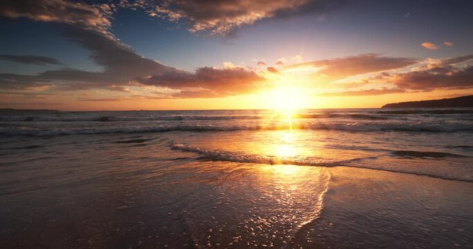 Ocean beach sunrise in 4k slow motion video. Sunny island.
