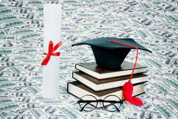 Graduation hats and diploma above dollar banknotes