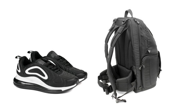 black backpack and black sneakers on a white background