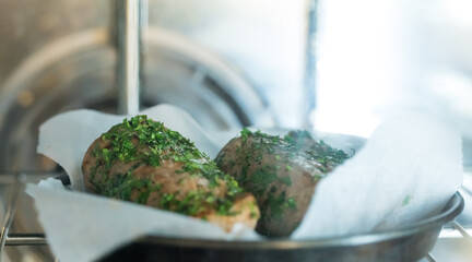 Cooking fresh meat in a dark kitchen 