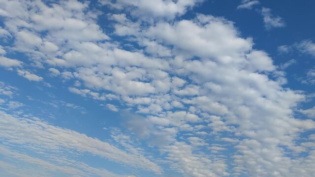 Cumulunimbus clouds gliding in a blue sky 2
