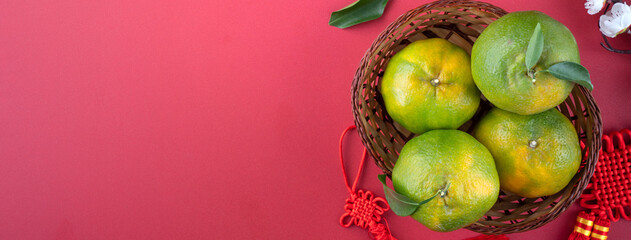 Top view of fresh orange on red background for Chinese lunar new year.