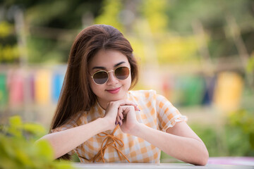 Portrait beautiful asian woman lifestyle resting in the park, relaxation concept, mind care