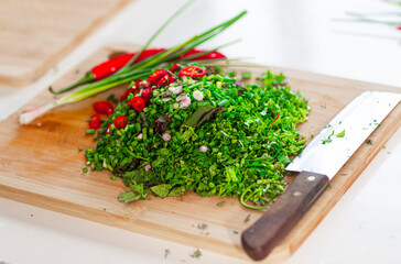 fresh herbs on a chopping board