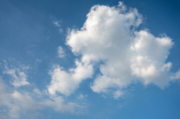 Naklejka na ściany i meble Blue sky with white clouds in daylight for background.