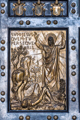 Religious catholic scene carved on bronze door