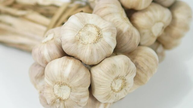 A bunch of fresh garlic isolated on white background