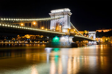 Szechenyi Chain Bridge in Budapest (Hungary) in front of the Buda Castle by night