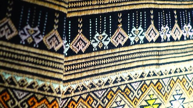 More than 100 years old colorful thai handcraft peruvian style rug surface old vintage torn conservation Made from natural materials Chemical free close up.