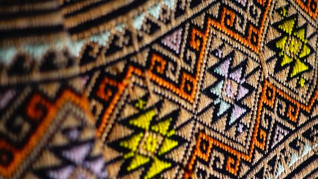 More than 100 years old colorful thai handcraft peruvian style rug surface old vintage torn conservation Made from natural materials Chemical free close up.