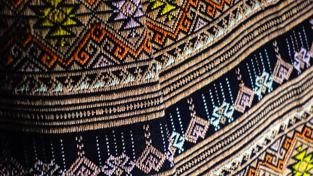 4K More than 100 years old colorful thai handcraft peruvian style rug surface old vintage torn conservation Made from natural materials Chemical free close up.