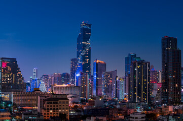 Fototapeta na wymiar cityscape of Bangkok city skyline with night light skyscraper building background in Central business district Bangkok, Thailand