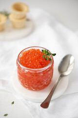 red salmon caviar in a glass jar