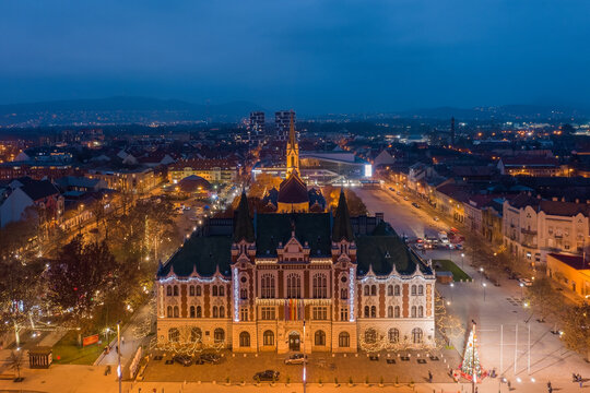 &Uacute;jpest, Budapest, Hungary - Aerial view of city hall of Ujpest with Queen of Heaven church and Christmas lights. Blue hour cityscape. &Uacute;jpest v&aacute;rosh&aacute;za.
