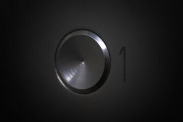 Elevator button with number 1. Level and floor. Close-up.