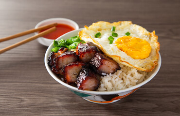 Chinese Sweet Bbq Pork is marinated in a sweet BBQ sauce and served with white rice.