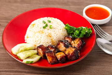Chinese Sweet Bbq Pork is marinated in a sweet BBQ sauce and served with white rice.