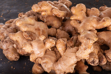 A closeup of fresh brown ginger in the market.