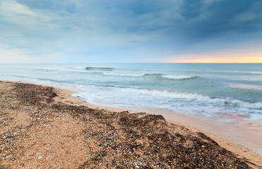 Sunrise over the Azov sea. Dramatic sky.