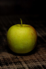 green apple on wooden table