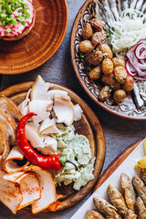 a large clay plate with a national Slavic delicacy - thinly sliced lard with spices on the table...