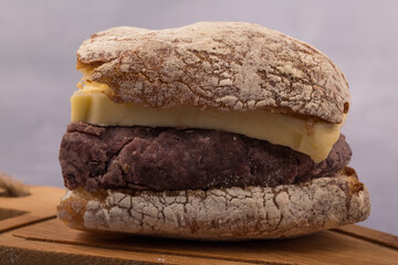 Korean sweet red bean paste and Butter bread sandwich on a wooden board.