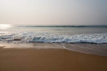 Fototapeta na wymiar A hazy winter morning at the beach in Odisha, India.