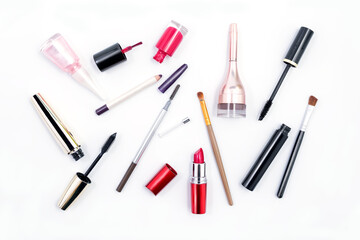 Makeup cosmetics such as brushes mascara, lipstick, eyeliner, nailpolish and makeup accessories isolated on white background
