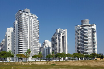 New residential area with modern houses and a large landscaping of the territory of the city of Holon in Israel.