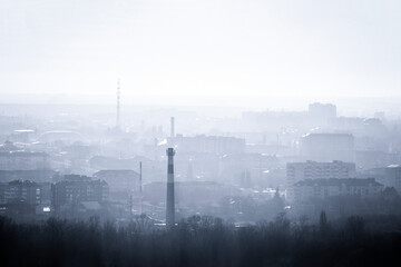 Obraz premium The city's skyline. Panorama of houses in the evening haze.