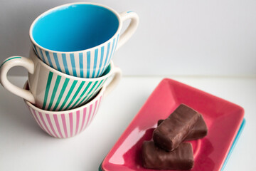 Multi-colored striped service with small cups and saucers